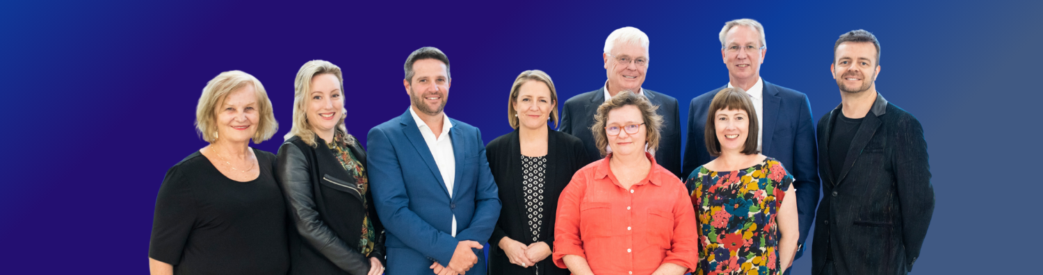 Image of prior members of the Tasmanian Leaders Board of directors. The group is lined up facing the camera, everyone is formally posed and smiling