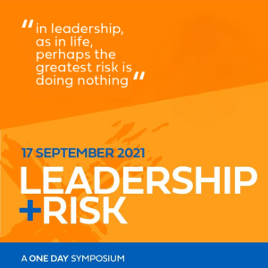 Leadership + Risk Symposium hero tile. An orange rectangle takes up the main area of the image. In front of the orange is two sections of text in white "in leadership as in life, perhaps the greatest risk is in doing nothing" and "17 September 2021 Leadership + Risk' in all caps. On the bottom of the tile is a blue rectangle with text in white "A One Day Symposium" in smaller all caps